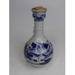 A Chinese blue & white glazed bottle vase, decorated with a pagoda within mountain landscape, height