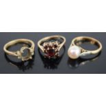 An 18ct gold cultured pearl dress ring, size O; together with a yellow metal ring (lacking centre