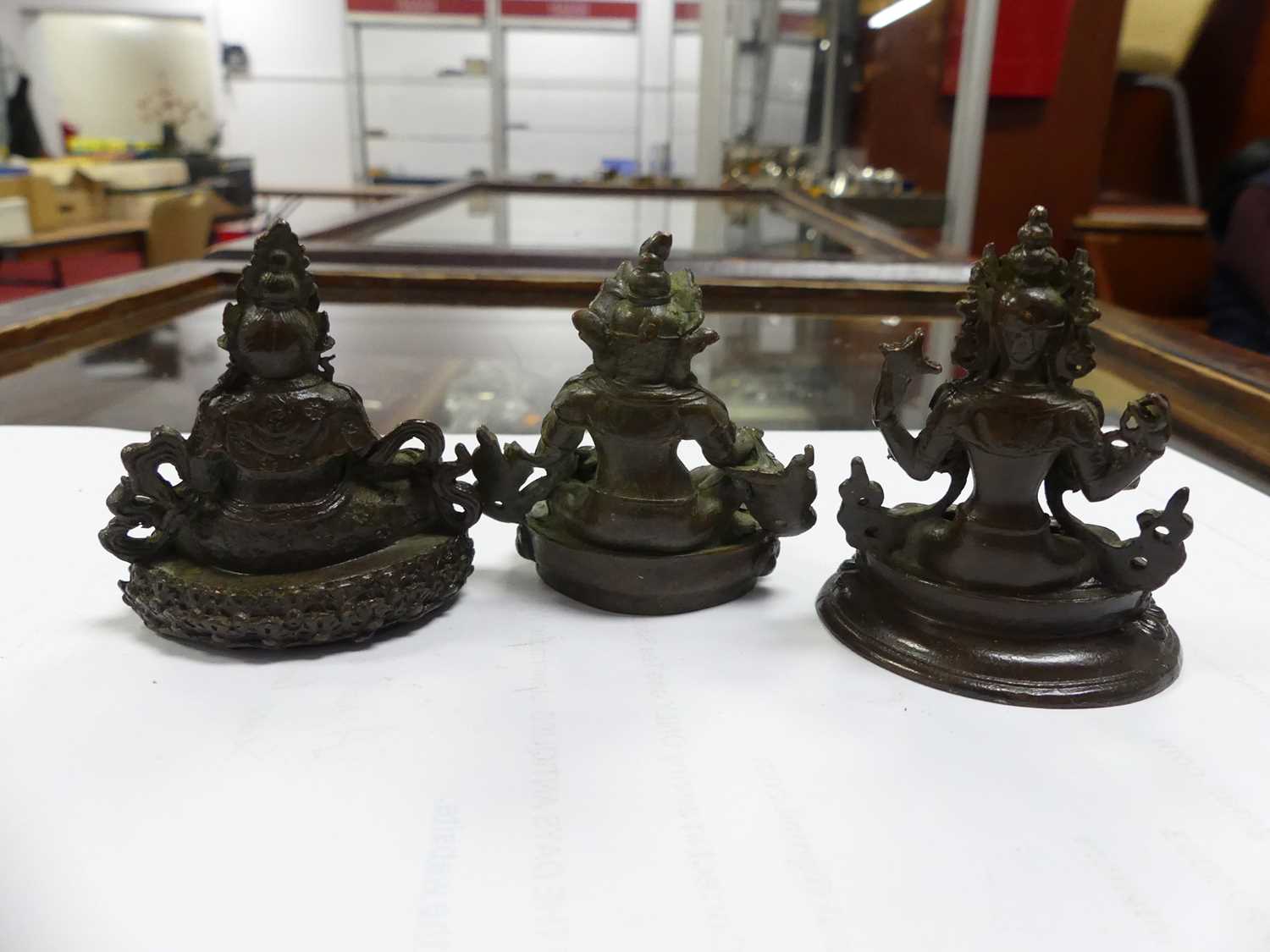 Three Chinese bronzed metal miniature Buddha figures, the largest h.5.5cm Of recent manufacture,. - Image 3 of 4