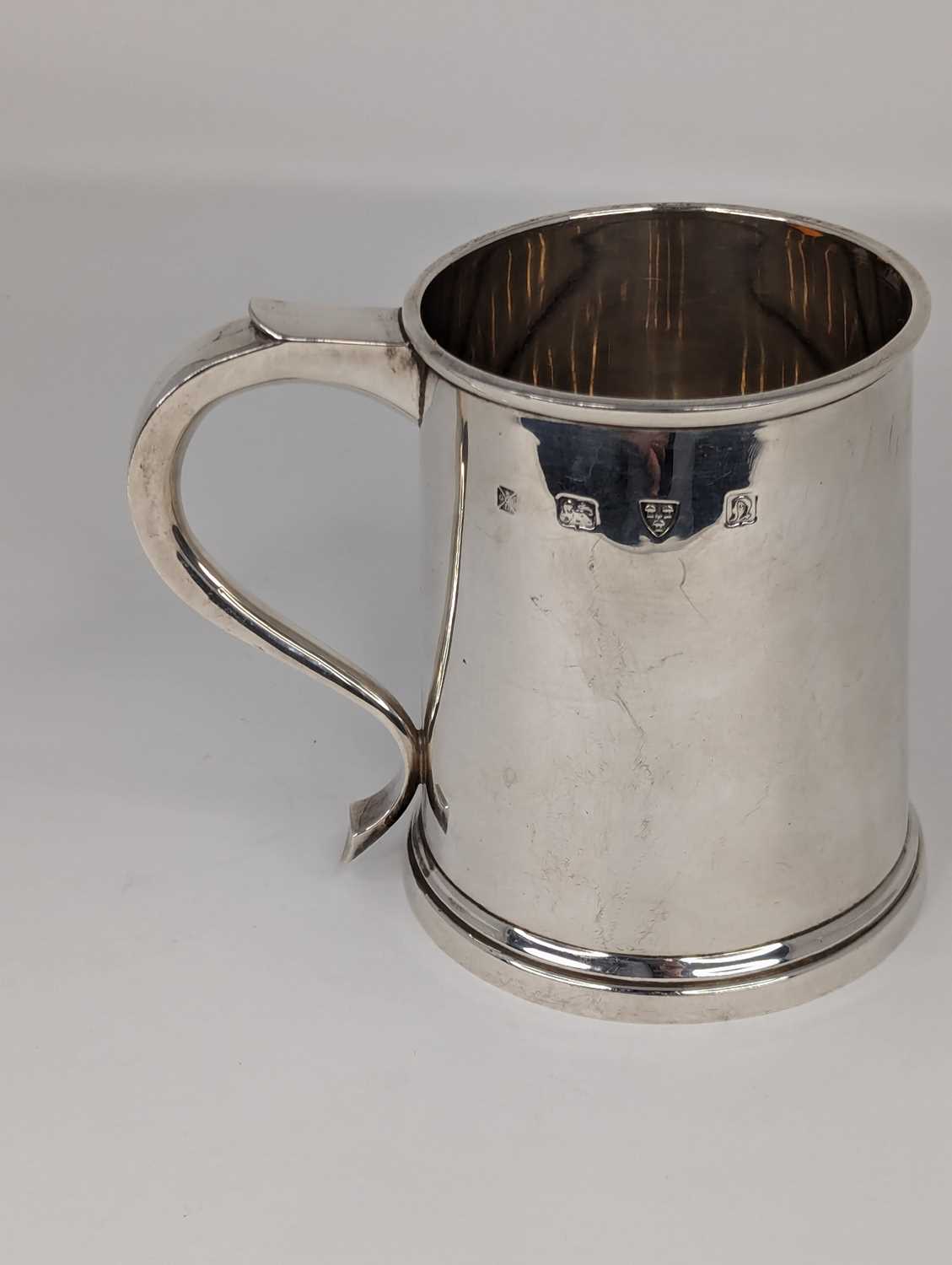 An Elizabeth II silver tankard of plain tapered cylindrical form with C-scroll handle, weight 10. - Image 2 of 2