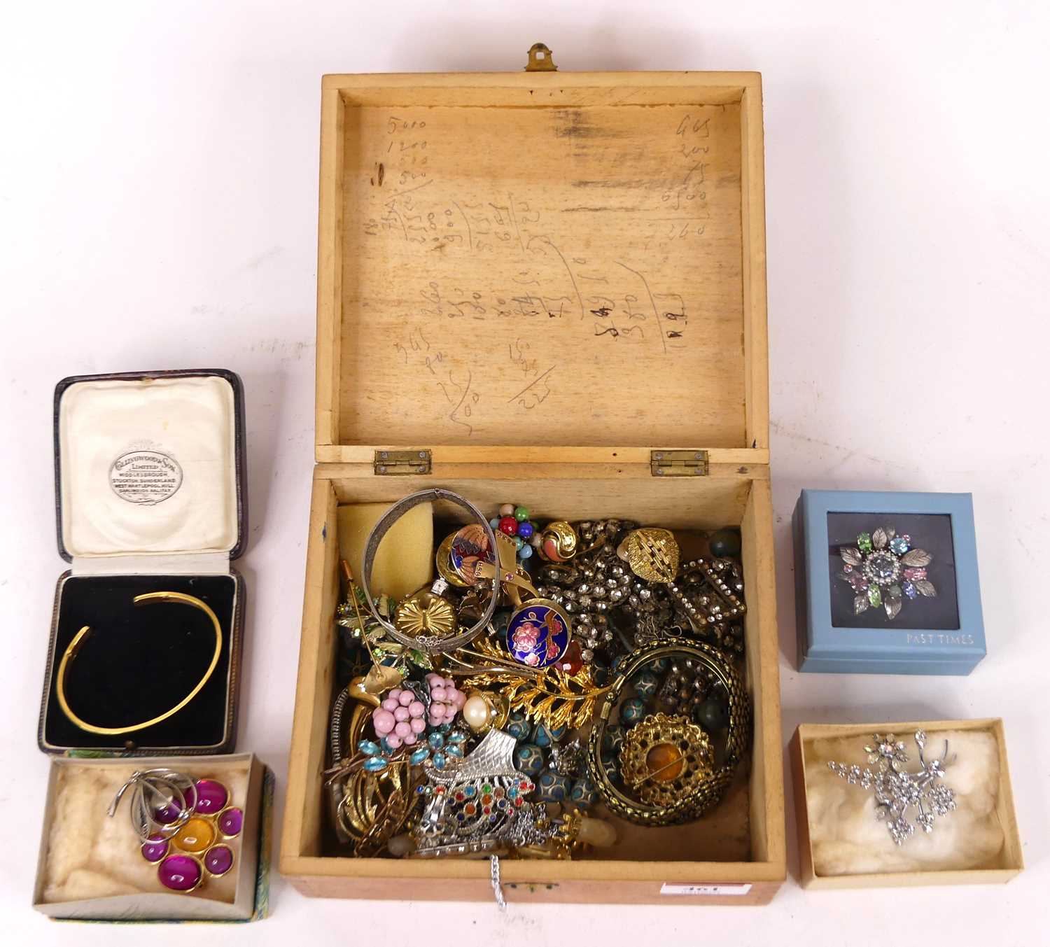 A collection of costume jewellery to include paste set brooches, ear clips and bangles