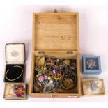 A collection of costume jewellery to include paste set brooches, ear clips and bangles