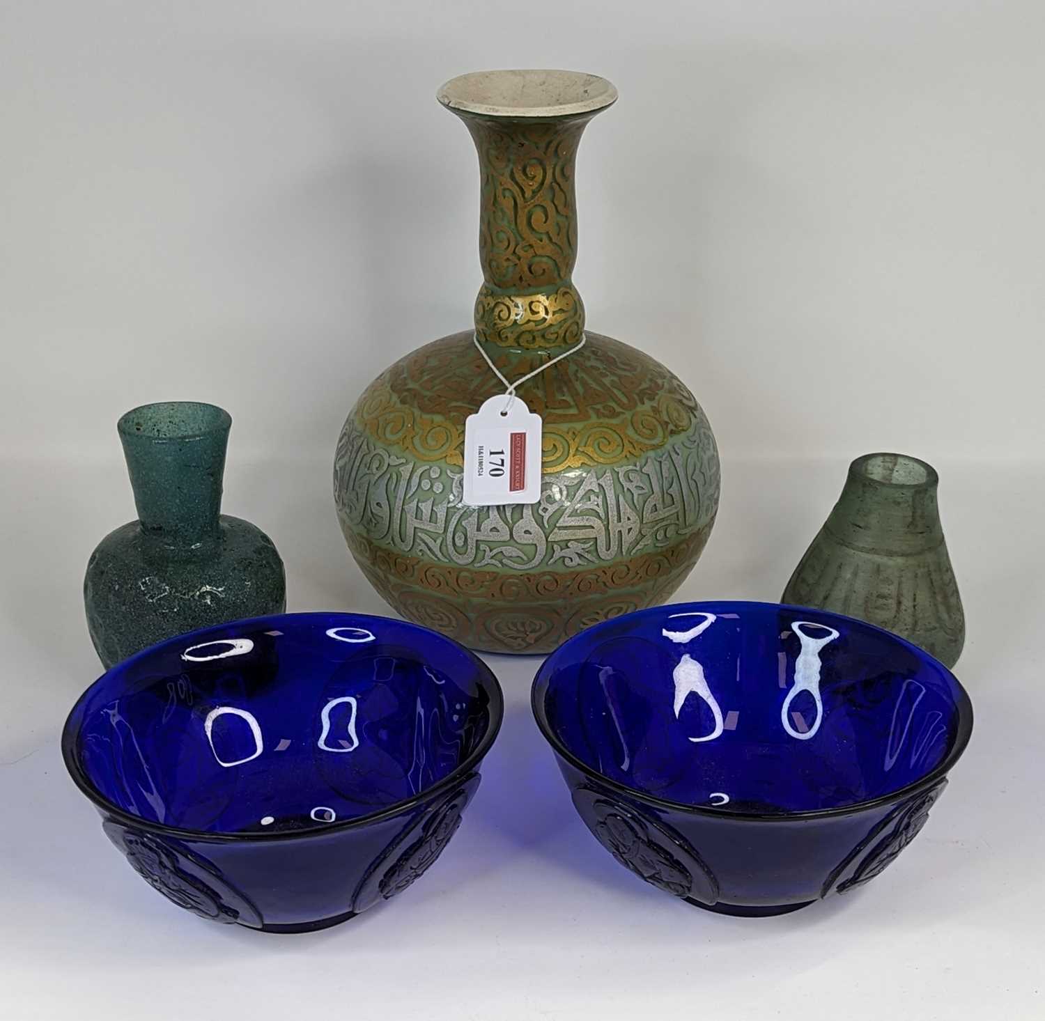 A collection of glassware to include a pair of Chinese blue glass bowls, relief decorated with