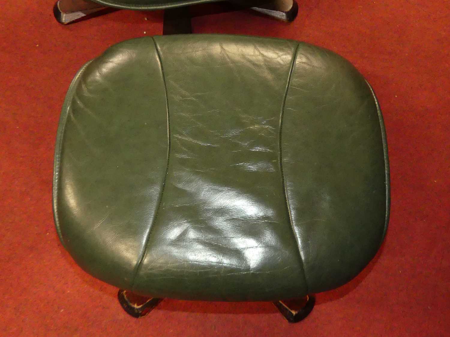 A contemporary green leather upholstered and formed laminate framed swivel armchair, with matching - Image 3 of 5