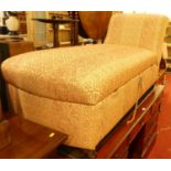 A cream and red floral striped fabric upholstered boxbase day-bed, having removable domed seat, on