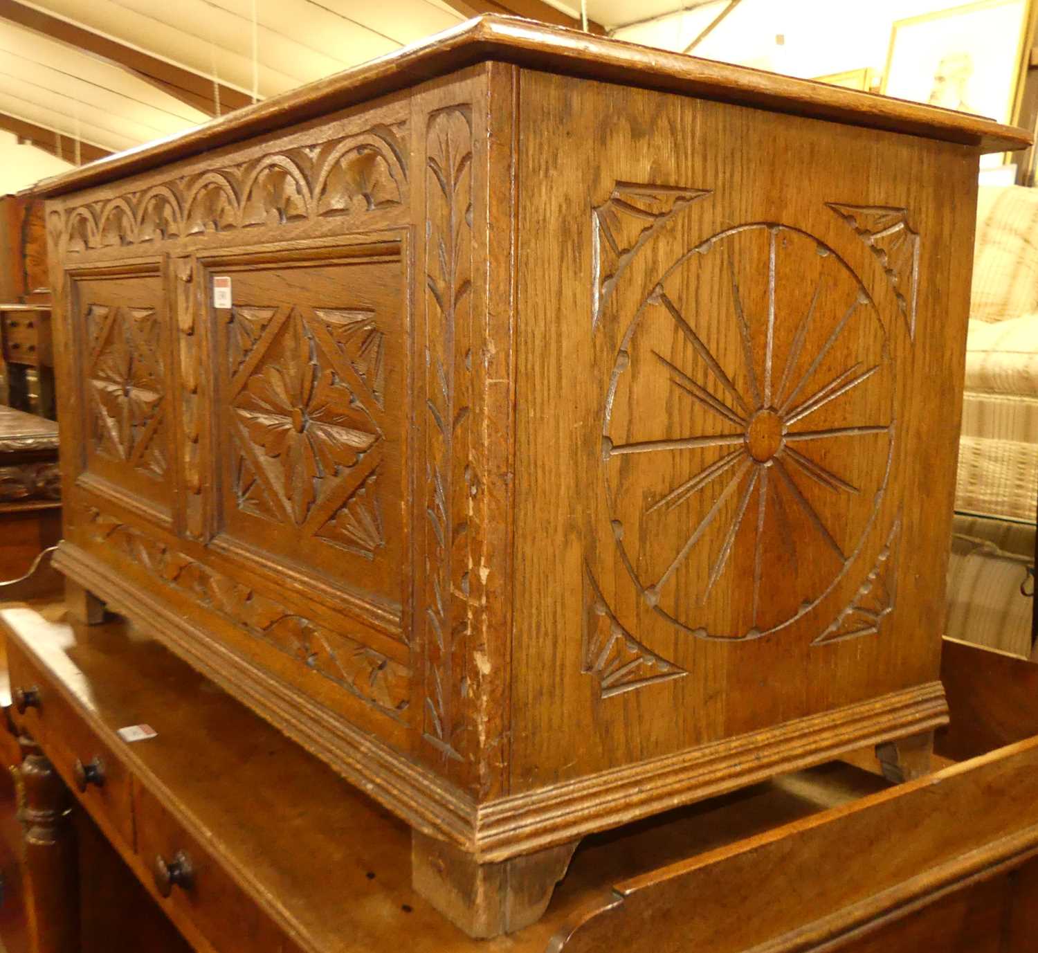 An Early 20th century floral relief and line carved oak two panelled hinge topped blanket chest, w. - Image 2 of 4