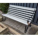 A black painted wrought iron ended and painted teak slatted three-seater garden bench, width 153cm