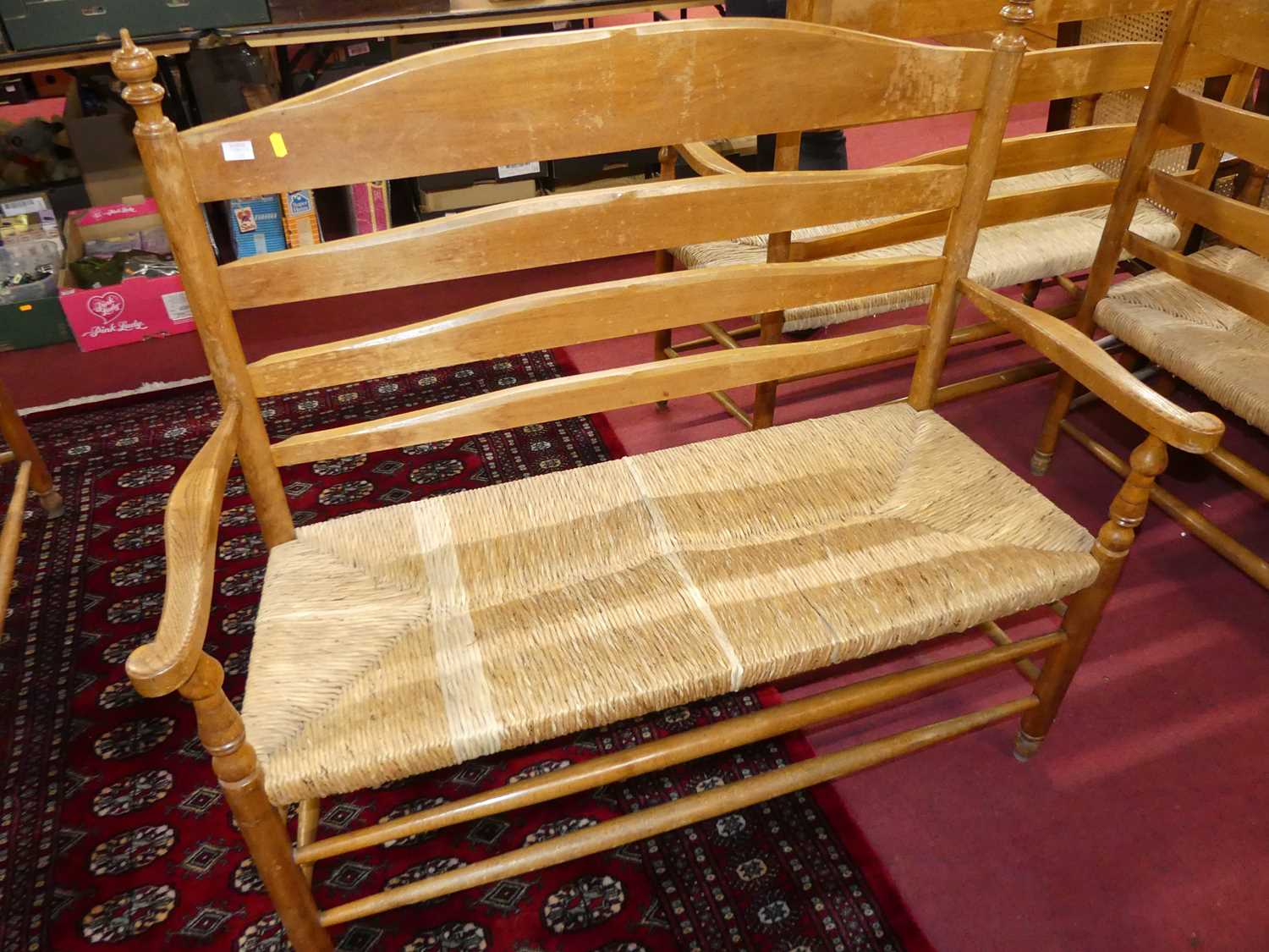 A set of four early 20th century elm and beech ladder back and rush seated two-seater settles, - Image 13 of 13