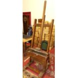 A large stained wood freestanding adjustable artists easel