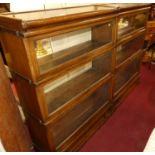 A pair of 1930s oak Globe Wernicke three-tier stacking bookcases, each with single long lower drawer