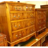 A contemporary yew wood bowfront chest of two short over three long drawers, w.72cm; together with a