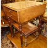 A mid-Victorian figured walnut three-division Canterbury, having single lower drawer on turned