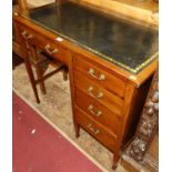 An Edwardian mahogany and gilt-tooled black leather inset pedestal kneehole writing desk, having