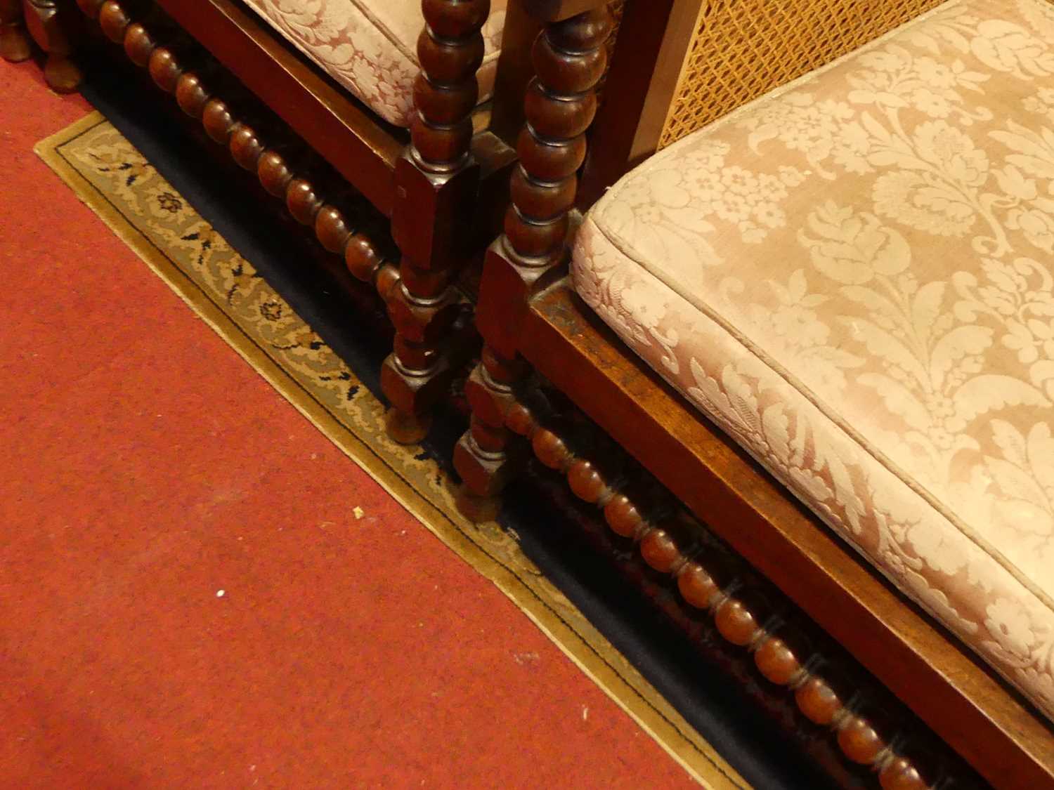 A pair of early 20th century indigenous hardwood and cane bergere chairs, raised on bobbin turned - Image 6 of 6