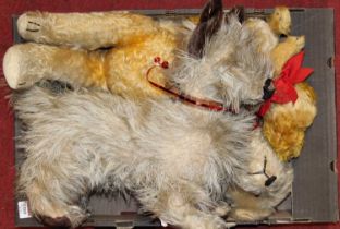 A collection of three various soft filled teddy bears and children's toys