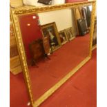 A large contemporary floral gilt decorated bevelled rectangular wall mirror, 138.5 x 196.5cm