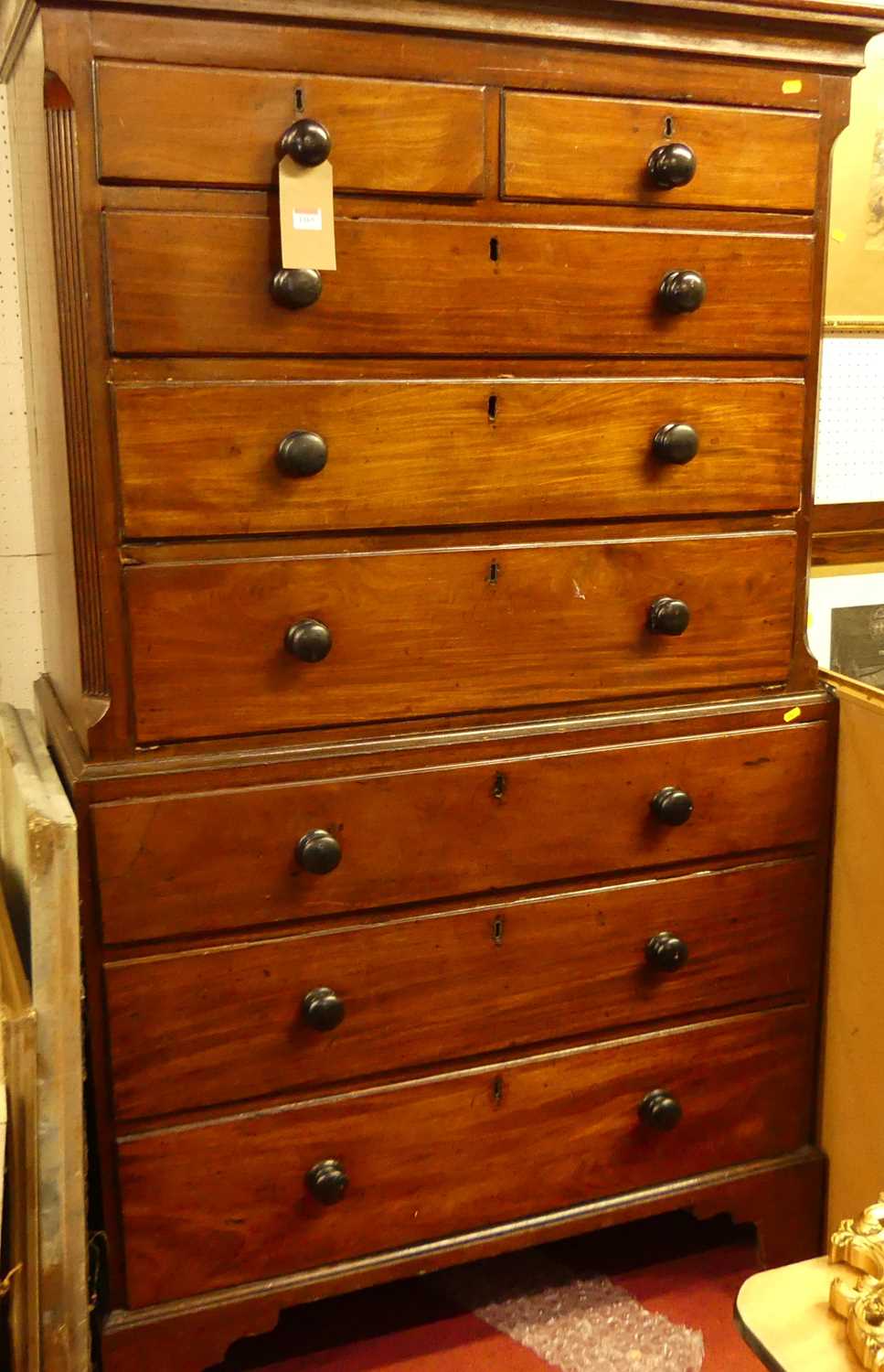 An early 19th century mahogany chest-on-chest, the upper section of two short over three long