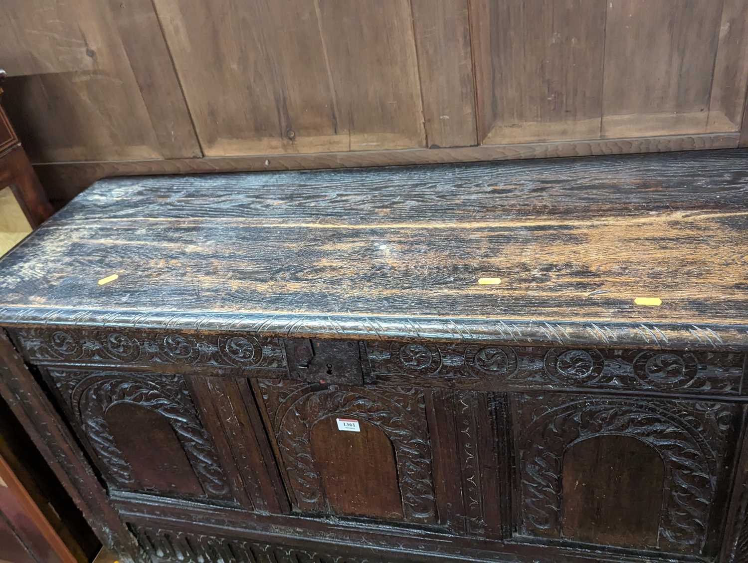 An 18th century joined oak three-panel hinge topped coffer, having later floral relief carved - Image 2 of 2