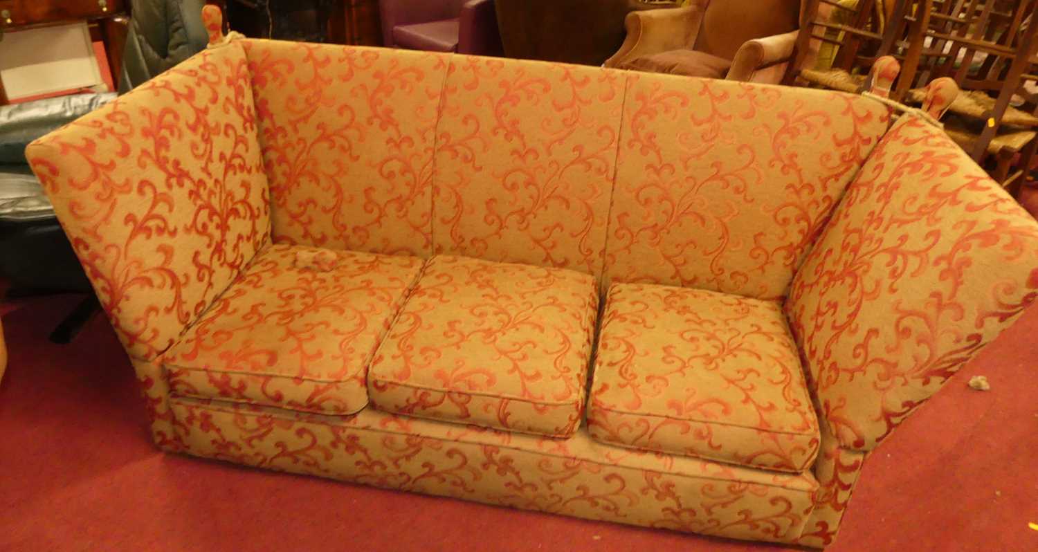 A red floral needlework upholstered three-seater Knoll sofa, having squab cushions, width 185cm Some