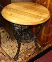 An early 20th century black painted pierced cast iron based pub table, by Caskell & Chambers Ltd
