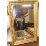 A pair of early 20th century gilt composition framed rectangular wall mirrors, each 63 x 42cm