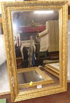 A pair of early 20th century gilt composition framed rectangular wall mirrors, each 63 x 42cm