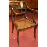 A French Empire style faded mahogany bar back single elbow chair, having a cane seat, width 46.5cm