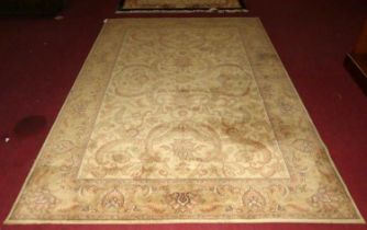 A Persian style machine made cream ground woollen Tabriz rug, 300 x 200cm