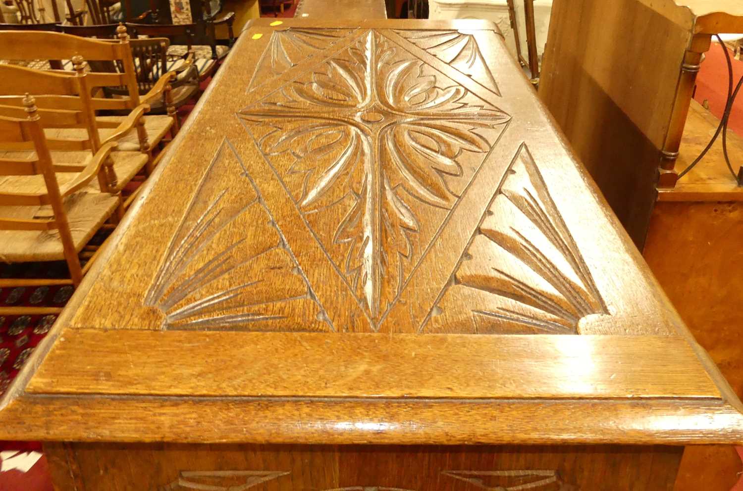 An Early 20th century floral relief and line carved oak two panelled hinge topped blanket chest, w. - Image 3 of 4