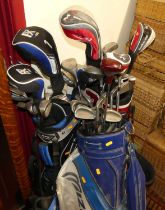 Three sets of various golf clubs, each with bags