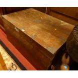 A circa 1900 camphor wood and brass bound military travelling trunk, having iron end carry handles