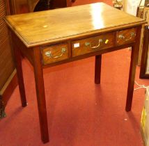 A 19th century mahogany three drawer side table, raised on chamfered square supports, w.78.5cm