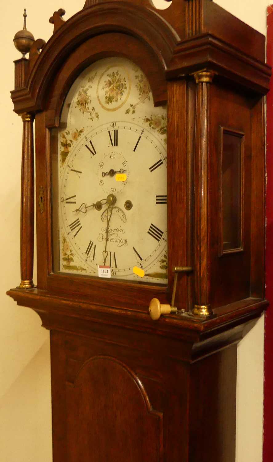 Martin of Feversham - early 19th century oak longcase clock, having a 12" painted arched dial,