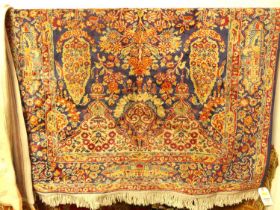A Persian woollen blue ground Tabriz rug, 162 x 118cm