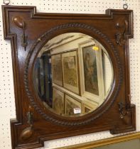 An oak framed and bevelled hall mirror, w.61cm
