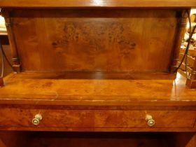 An Edwardian low two drawer side table; together with a reproduction waterfall open bookshelf with