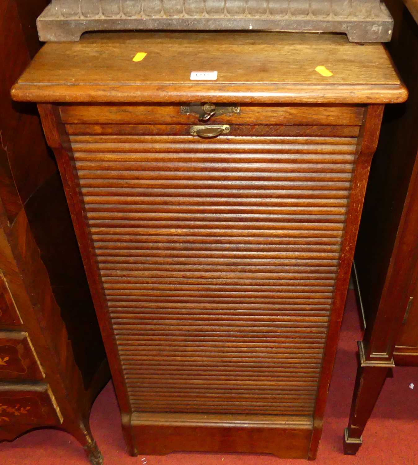 A 1920s oak tambour fronted office filing cabinet, w.48cm