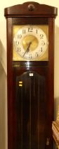 A 1920s stained beechwood longcase clock, having painted metal square Arabic dial, three train