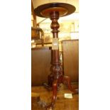 A Victorian mahogany circular topped pedestal occasional table, raised on turned and fluted column