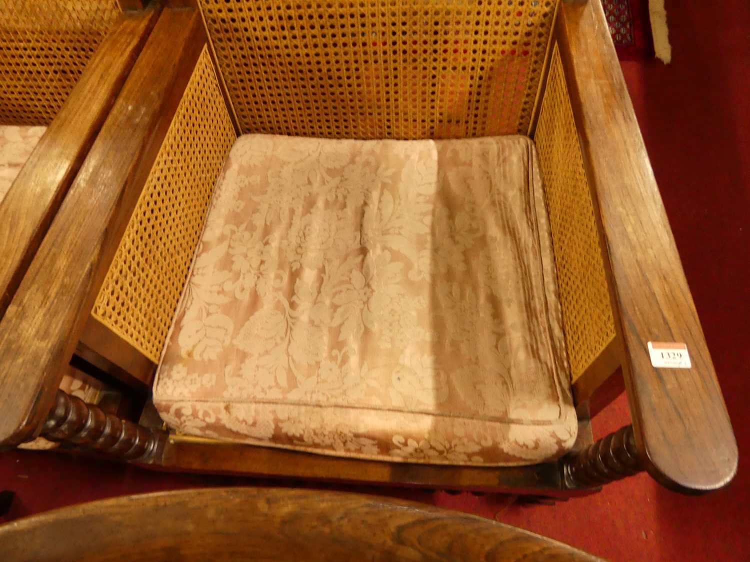 A pair of early 20th century indigenous hardwood and cane bergere chairs, raised on bobbin turned - Bild 2 aus 3