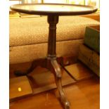 A 19th century and later adapted circular dish-topped fixed pedestal tripod low occasional table,