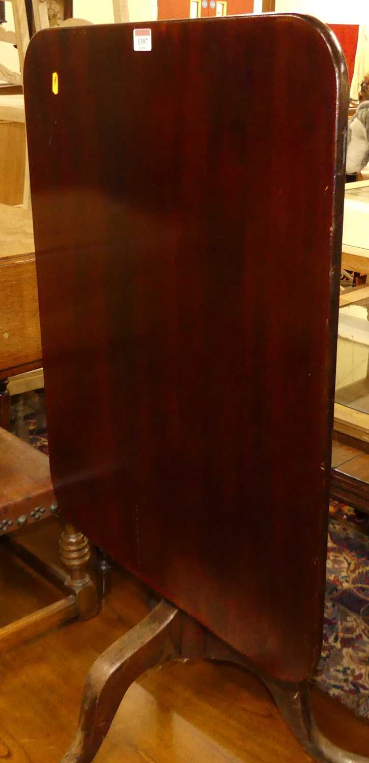 A 19th century mahogany round cornered tilt-top pedestal tripod occasional table, length 73cm