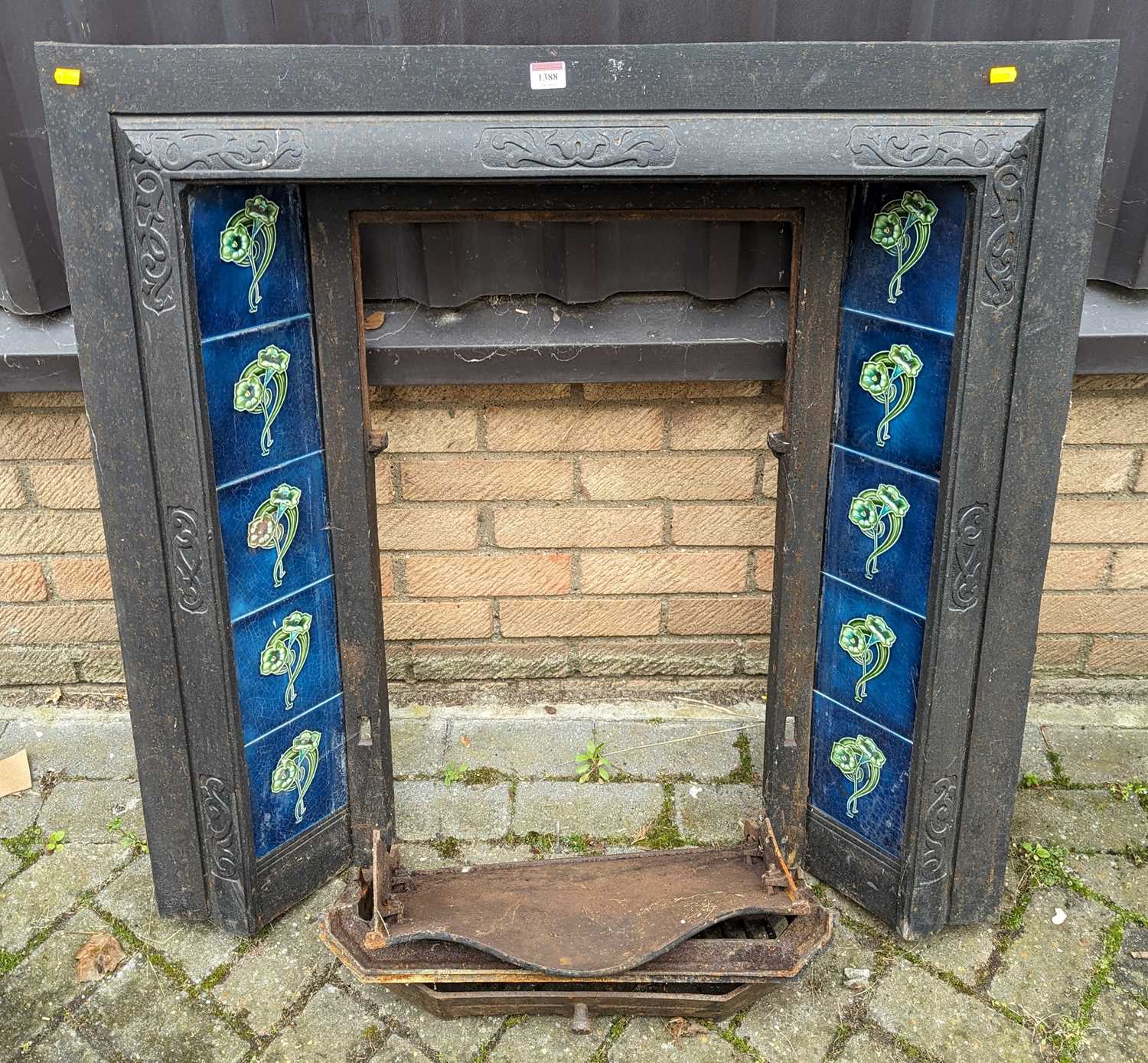 An Edwardian cast iron and tiled fire insert, 97 x 96cm