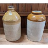 Two glazed stoneware storage jars, the larger h.44cm