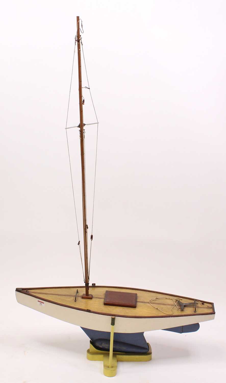 A very well made 1960s wooden hull pond yacht, hand painted in white with stained wooden deck,