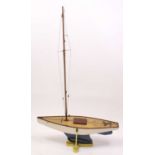 A very well made 1960s wooden hull pond yacht, hand painted in white with stained wooden deck,