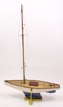 A very well made 1960s wooden hull pond yacht, hand painted in white with stained wooden deck,