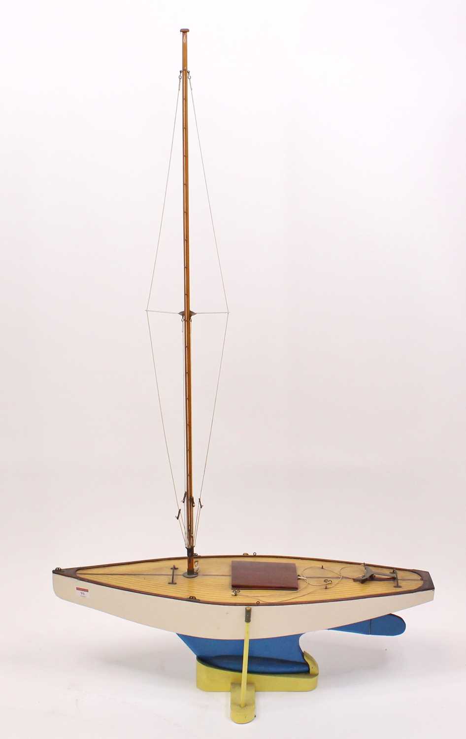 A very well made 1960s wooden hull pond yacht, hand painted in white with stained wooden deck,