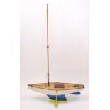 A very well made 1960s wooden hull pond yacht, hand painted in white with stained wooden deck,