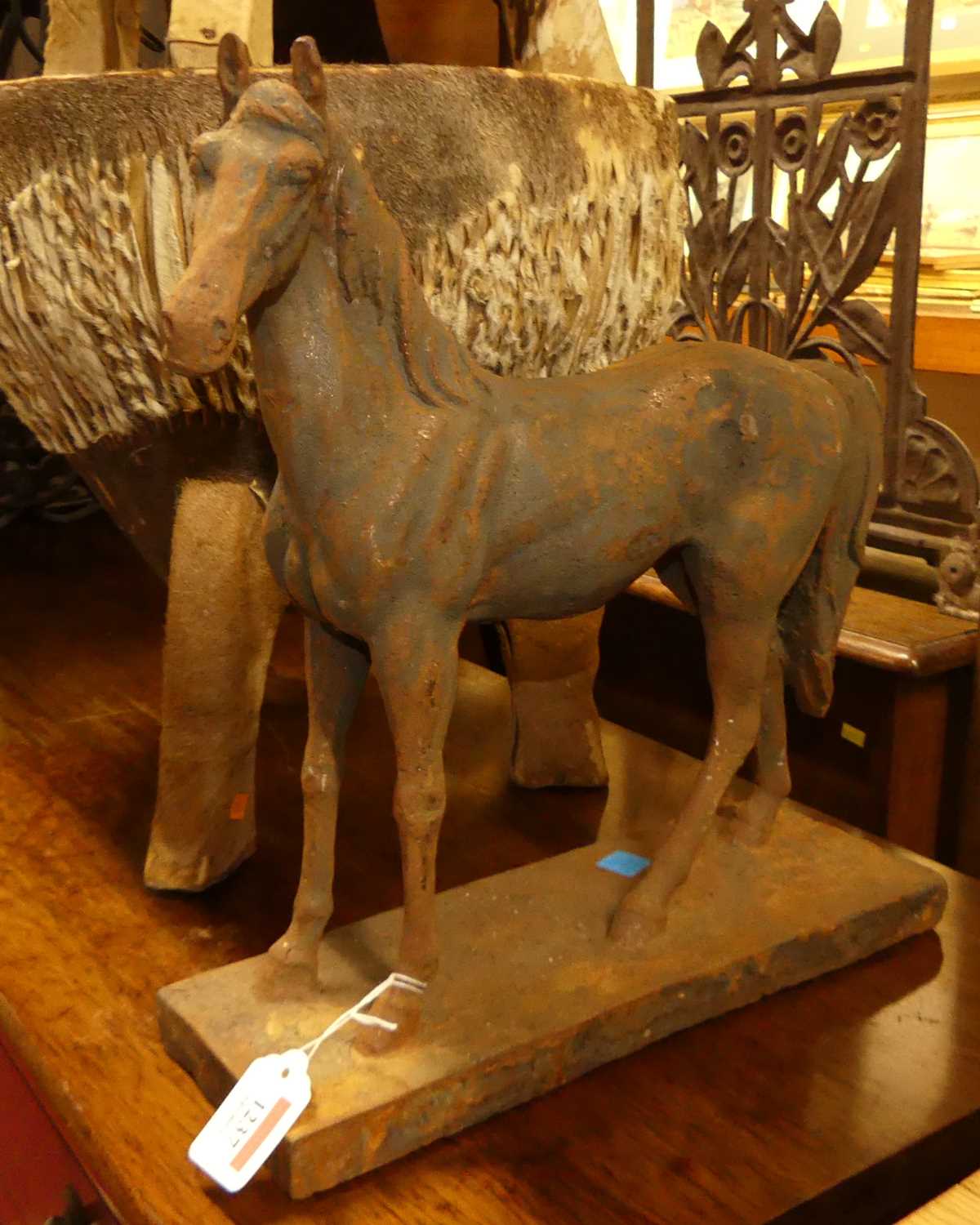 A contemporary cast iron model of an equine horse, length 34cm